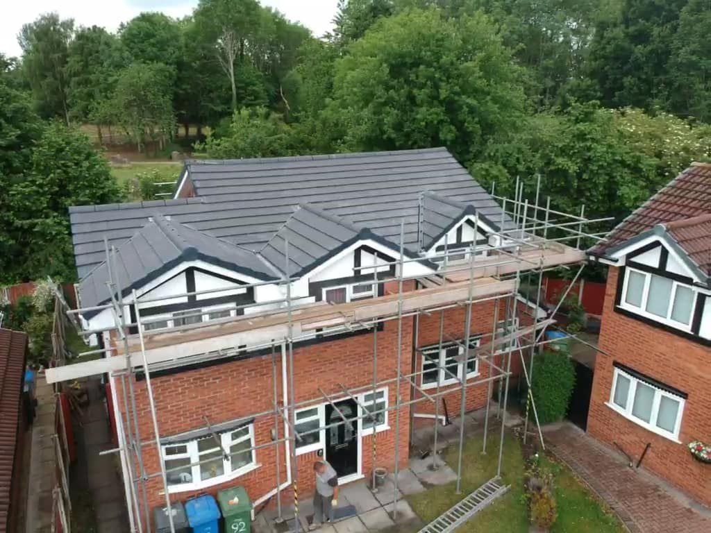 Brick house in Berkshire with completed roofline, guttering and fascias by H Lee & Son Roofing Services