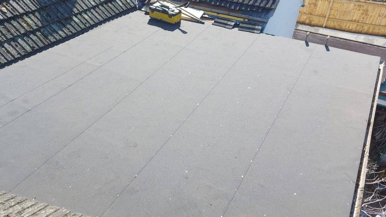 Clean grey flat roof installation finished by H Lee & Son Roofing Services