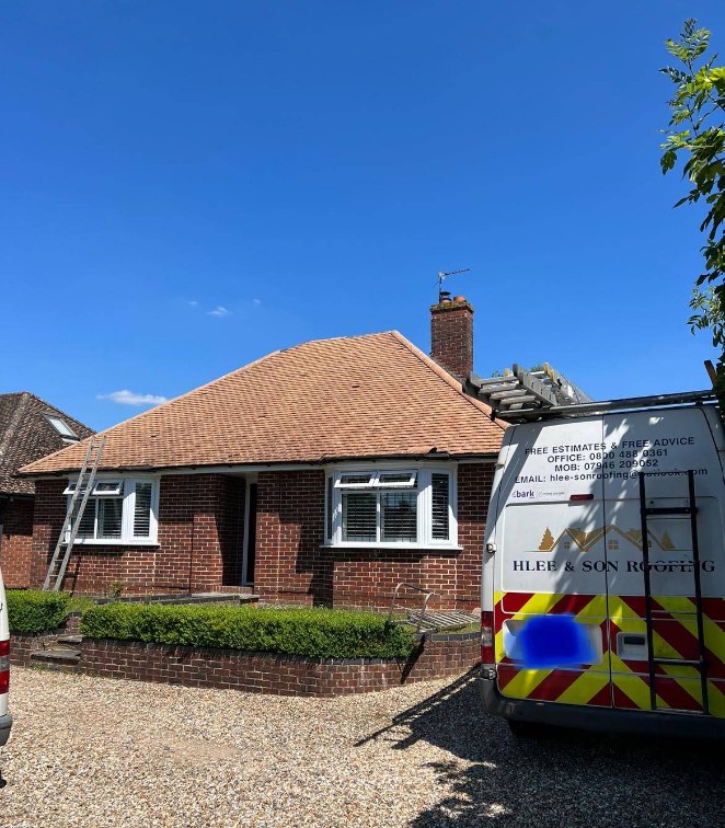 H Lee & Son branded van outside a bungalow with a newly completed roof