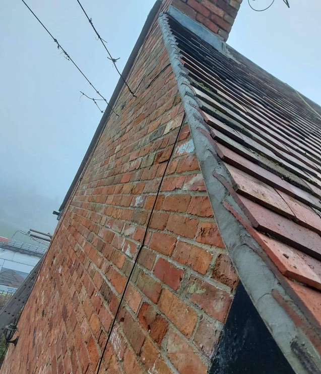 Repointed chimney brickwork and fresh mortar bedding after chimney repairs