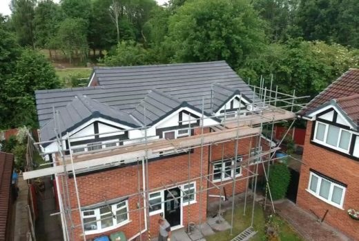 Completed tiled roof slope with new ridge and verge detailing on a Berkshire home
